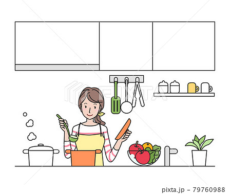 キッチンで料理をするエプロン姿の若い女性 79760988