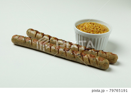 Grilled sausage and sauce on white background Grilled sausage and sauce on white background 79765191