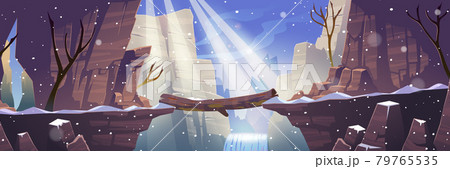 Log bridge at winter mountains above rock cliff 79765535