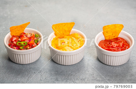 Three mexican salsa, pico de gallo, cheese and spicy tomato sauces 79769003