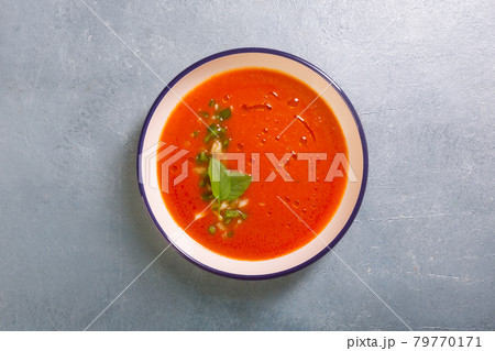 Plate of gazpacho made from tomato with garlic and basil leaves copy space Plate of gazpacho made from tomato with garlic and basil leaves copy space 79770171