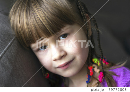 Portrait of pretty little girl with small braids Portrait of pretty little girl with small braids 79772003