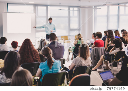 Speaker giving presentation on business conference. Speaker giving presentation on business conference. 79774169