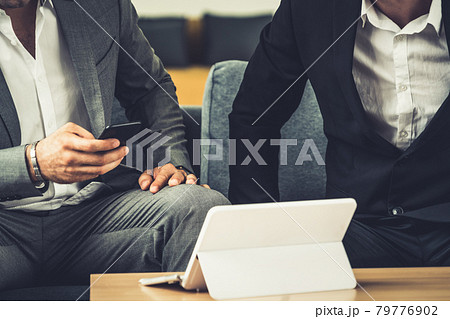 Businessmen are in business meeting in office. 79776902