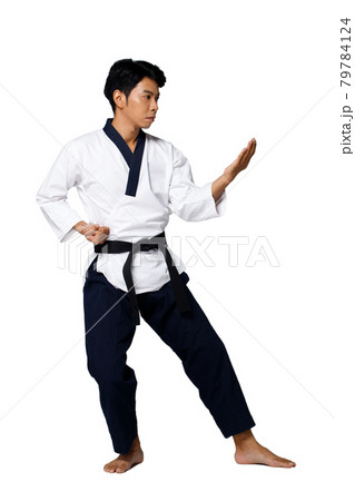 Sport Master of TaeKwonDo practice Karate Poses, isolated full length 79784124