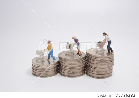 the figures standing with a shopping cart on three pile of stepped coins. the figures standing with a shopping cart on three pile of stepped coins. 79786232