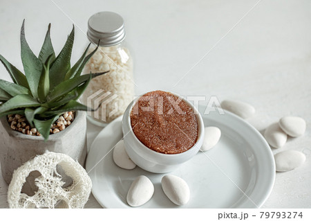 Spa composition with natural face and body scrub. Spa composition with natural face and body scrub. 79793274