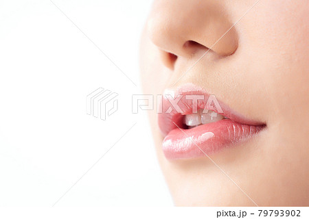 Close-up Beautiful lips. Part of face, young asian woman close up. Sexy plump lips Nude lipstick Close-up Beautiful lips. Part of face, young asian woman close up. Sexy plump lips Nude lipstick 79793902