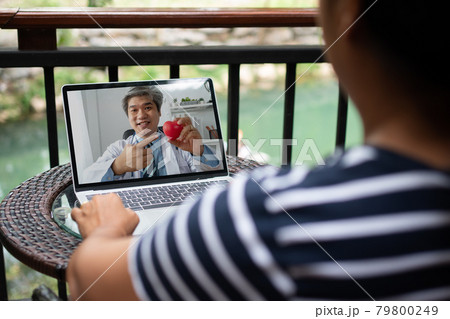 Asian doctor or therapist help relieve stress and provide knowledge and understanding about heart disease to patients video conference call online live talk remotely at home Asian doctor or therapist help relieve stress and provide knowledge and understanding about heart disease to patients video conference call online live talk remotely at home 79800249