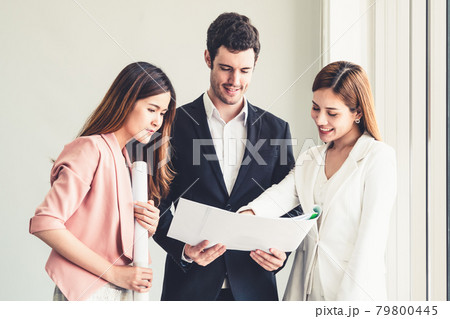 Businessman and businesswomen working in office. Businessman and businesswomen working in office. 79800445