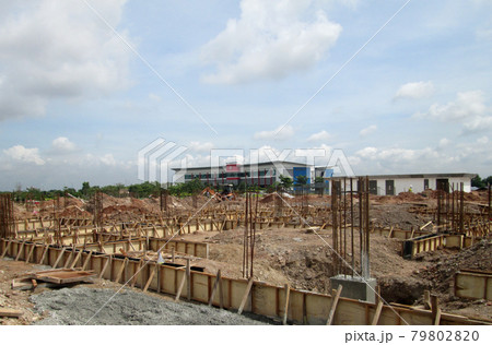 SERDANG, MALAYSIA -APRIL 1, 2017: Building ground beam under construction. Made from steel reinforced concrete and the mold made from timber and plywood. Constructed by workers.  79802820