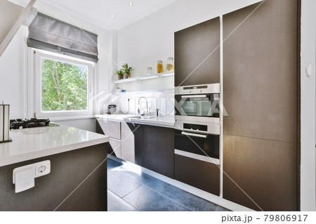 Interior of a beautiful kitchen of an elite house Interior of a beautiful kitchen of an elite house 79806917
