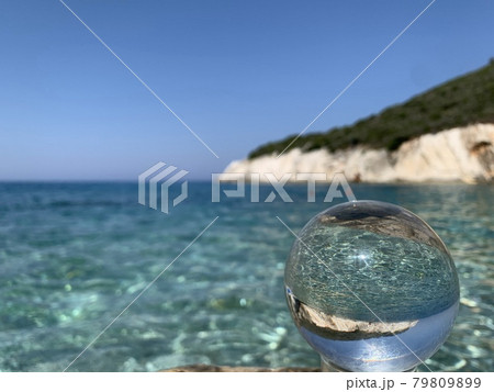 close up crystal glass ball at the beach. close up crystal glass ball at the beach. 79809899