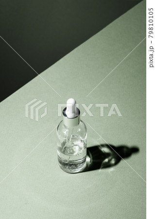 Dropper glass Bottle Mock-Up. Body treatment and spa. Natural beauty products. Eco cream, serum, skin care blank bottle. Anti-cellulite massage oil. Oily cosmetic pipette 79810105