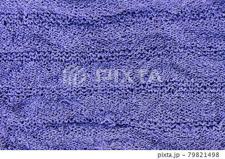 Natural woolen fabric fragment. Knitted texture closeup. Warm yarn background. Natural woolen fabric fragment. Knitted texture closeup. Warm yarn background. 79821498