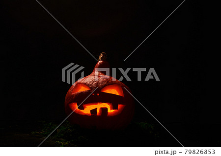Pumpkin with burning mouths and eyes on blank black background. Jack-o-lantern decoration. Pumpkin with burning mouths and eyes on blank black background. Jack-o-lantern decoration. 79826853