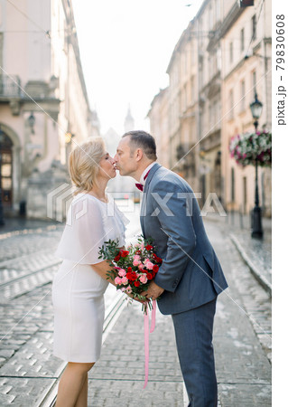 Outdoors portrait of romantic couple in the old city. 79830608