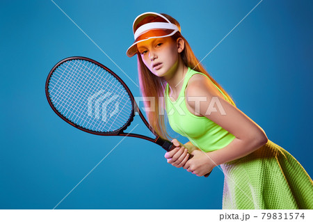 girl teenager with racket in sporswear and hat girl teenager with racket in sporswear and hat 79831574