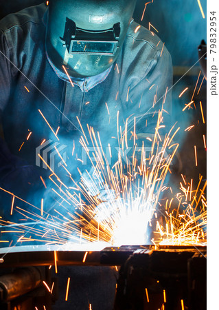 welder with protective equipment in factory welder with protective equipment in factory 79832954