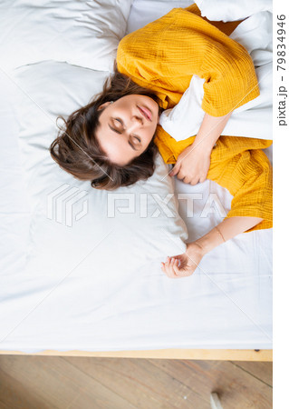 A beautiful middle-aged woman asleep. Healthy sleep and recovery concept. 79834946