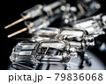 Several halogen small incandescent lamps with a blurry background 79836068