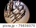 Several halogen small incandescent lamps with a blurry background 79836070