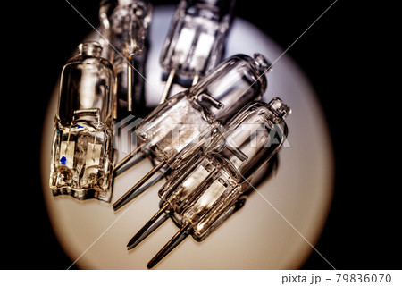 Several halogen small incandescent lamps with a blurry background Several halogen small incandescent lamps with a blurry background 79836070