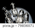 Several halogen small incandescent lamps with a blurry background 79836071