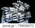Several halogen small incandescent lamps with a blurry background 79836072