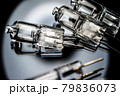 Several halogen small incandescent lamps with a blurry background 79836073