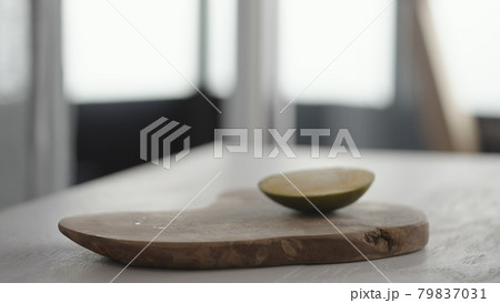 Ripe mango on olive board on white oak table 79837031