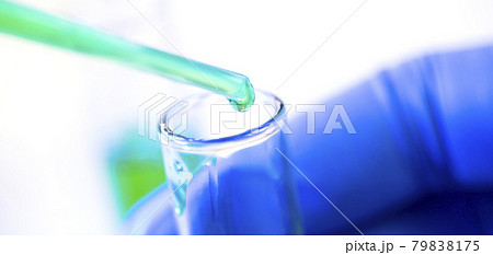 Chemical test tubes and pipette with green liquid close up in a chemical laboratory 79838175
