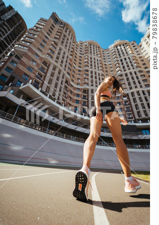 A young beautiful dark-haired athletic girl, warming up 79838678