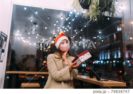 Portrait happy young beautiful woman, hold gift box and smile in cafe. 79838747