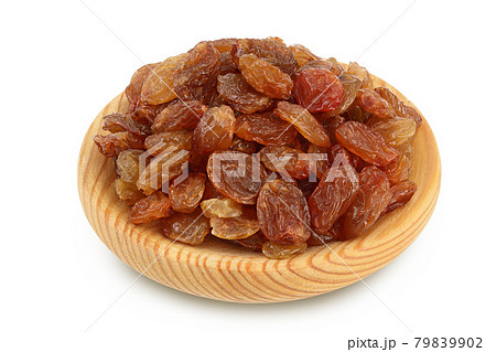 Brown raisins in wooden bowl isolated on white background with clipping path and full depth of field 79839902