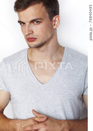 young handsome teenage hipster guy posing emotional, happy smiling against white background isolated, lifestyle people concept 79840495