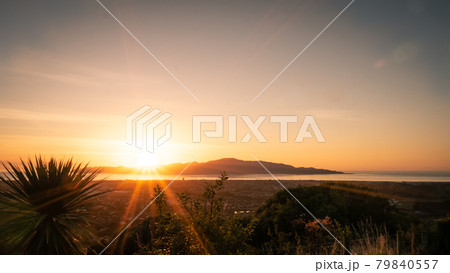 Sunset shot with colorful sky with Kapiti Island in backdrop shot on outlook above Paraparaumu on Kapiti coast, Wellington, North Island Sunset shot with colorful sky with Kapiti Island in backdrop shot on outlook above Paraparaumu on Kapiti coast, Wellington, North Island 79840557