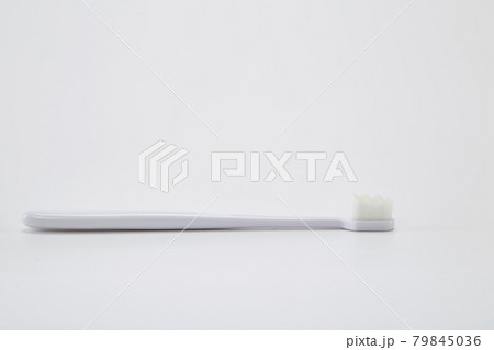 White plastic toothbrush with white bristle 79845036