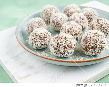 Home made energy protein balls with coconut flakes and nut butter 79904703