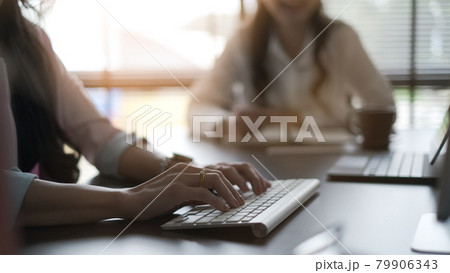 Cropped shot of businesswoman is  typing on keyboard at meeting room. 79906343