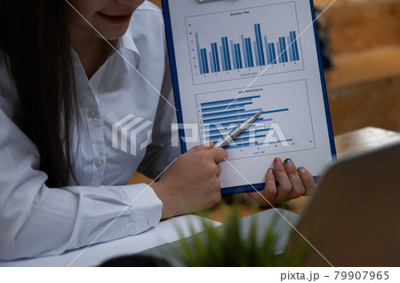 Fund managers researching and analysis Investment stock market meeting with her team by video call. Fund managers researching and analysis Investment stock market meeting with her team by video call. 79907965