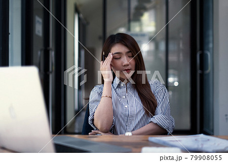 Frustrated stressed business owner or accountant sitting in an office because covid-19 has disappoint. Close business cafe shop concept. 79908055