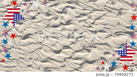 Digitally generated image of american flag design over stars against sand in background 79909275