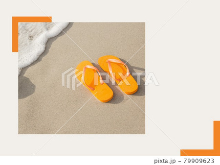 Photograph of orange flip flops at the beach against grey background 79909623