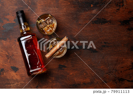Scotch whiskey bottle, glasses and cigar Scotch whiskey bottle, glasses and cigar 79911113