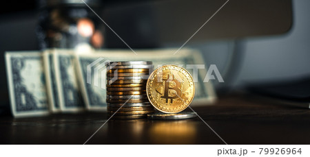 gold bitcoins placed on a wooden desk gold bitcoins placed on a wooden desk 79926964