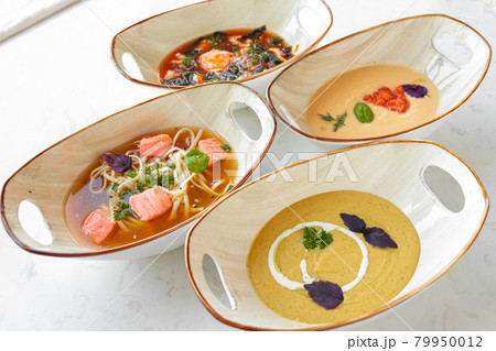 Tom Yam, Miso soup and cream soups on gray table 79950012
