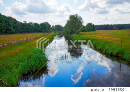 Go for a walk by the peaceful quiet river alone and change your surrounding Go for a walk by the peaceful quiet river alone and change your surrounding 79956364