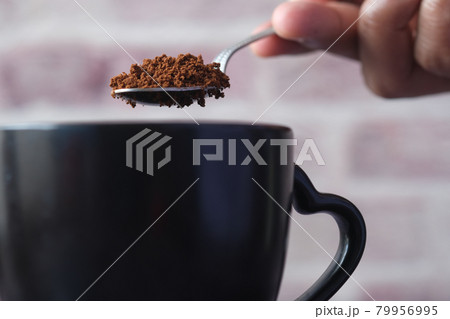 close up of mixing coffee power with hot water close up of mixing coffee power with hot water 79956995