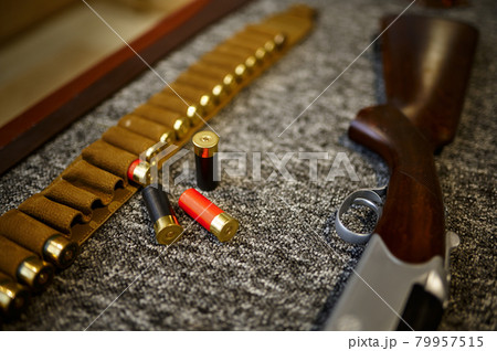 Hunting rifle, bandolier and cartridges, gun store Hunting rifle, bandolier and cartridges, gun store 79957515